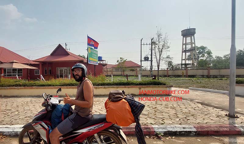 Backpackers travel by motorbike from Vietnam to Cambodia to Laos